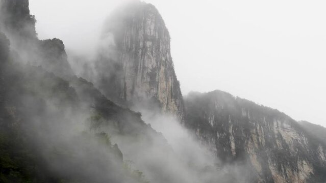 Rainy clouds moving around mountains like fairy wonder land, 4k time lapse footage, Enshi valley in Hubei province.