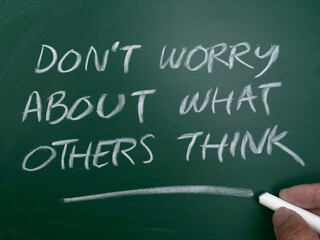 Dont worry about what others think, quote text written on wooden block, motivation inspiration