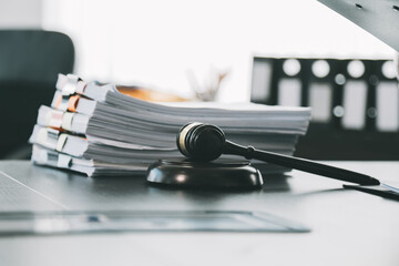 Business and lawyers discussing contract papers with brass scale on desk in office. Law, legal...