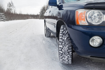 Car with winter tires on a winter road