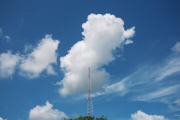 Mobile phone antenna, bright sky background, wide angle photography