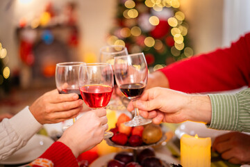 Happy - cheerful caucasian white family enjoy the time to celebrating the Christmas Eve and New Year festival together, caucasian white people family cheers a wine together in Christmas party.