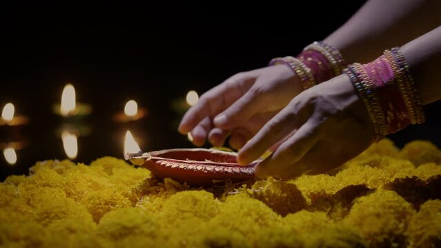 Clay diya lamps lit during diwali celebration, Diwali, or Deepavali, is India's biggest and most important holiday.