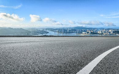 Fototapeta premium Asphalt road and mountain skyline background in Macau