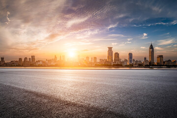 Shanghai city asphalt road and building landscape at sunset