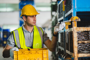 Factory manager, foreman worker checking stock inventory on good shelf in delivery storehouse of...