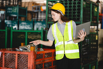 Factory manager, foreman worker checking stock inventory on good shelf in delivery storehouse of...