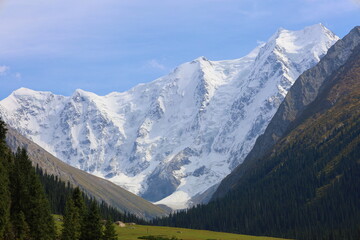 Fototapeta premium Tenth stage of Ak-Suu Traverse trek with a view of Karakol peak and Aylanish glacier in Kyrgyzstan