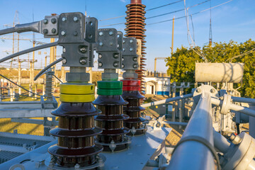 Converter transformer with ceramic insulators and bushings at a substation.