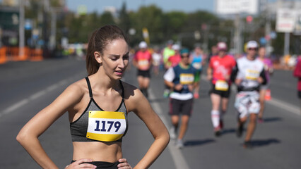 Female runner jog sport marathon slow motion. Tired woman athlete take break. Jogger work out. Deep...