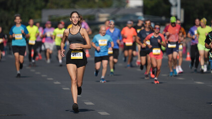Happy female runner jog sport marathon. Smile sportswoman work out public park. Woman athlete fast...
