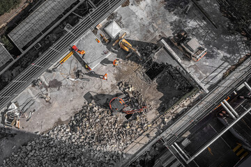 Aerial drone photo of demolition site and construction workers
