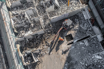 Aerial drone photo of demolition site and construction workers