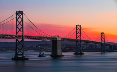 Fototapeta na wymiar San Francisco Bay Bridge West Span During Colorful Sunset