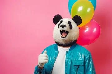 Fotobehang Man wearing a panda mask while standing on colored background, funky style, party advertising, happy panda mask © VisualProduction