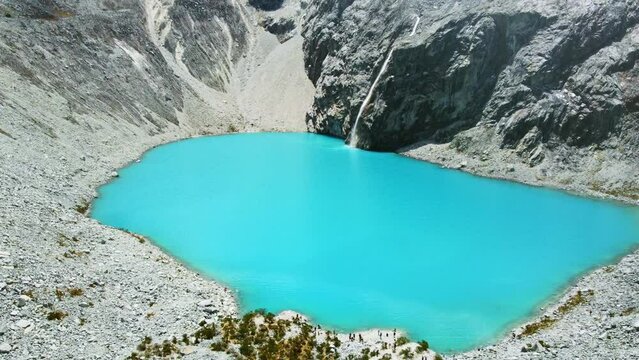 Laguna 69 beautiful vivid blue lagoon in the Andean Mountains in Huaraz Peru tourism beyond Machu Picchu
