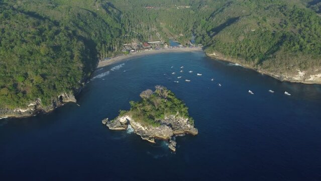 Aerial 4K Drone Footage: Majestic Crystal Bay Sunset, Nusa Penida, Bali; Tropical Bliss with Floating Boats, Palm-Lined Beach, and Azure Waters; Ideal for Travel Vlogs and Relaxation Content