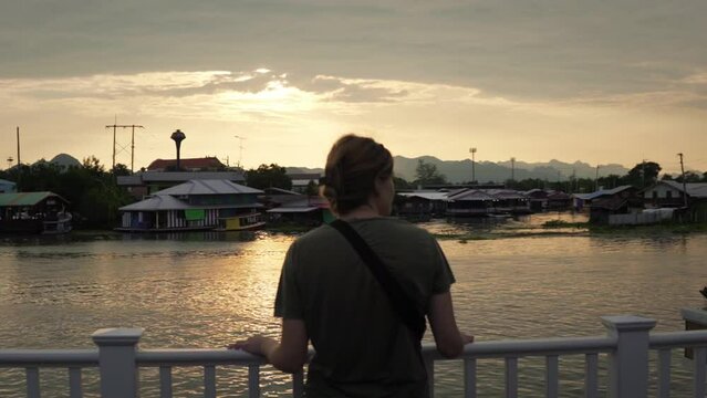 Backpacking through Asia and travel footage. Girl at sunset in Thailand