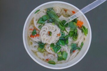 A bowl of white crackers from above