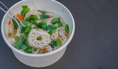 Close-up view of a bowl of white crackers
