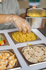 Taking the macaroni seblak ingredients is put into sorting