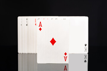 Playing cards on black background studio shot
