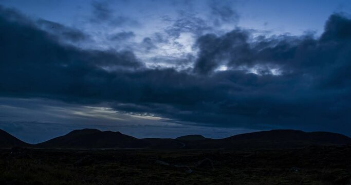 Time Lapse of Dark Clouds Over volcanic landscape at the base of Geldingadalir Volcano, Iceland - wide pan