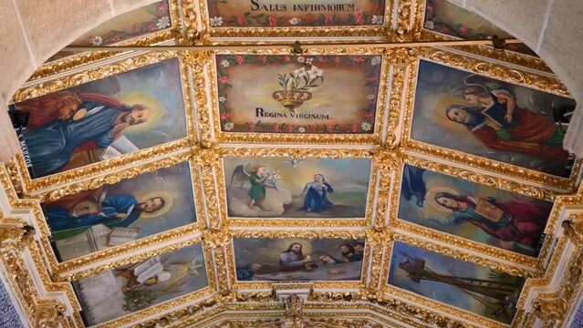 Portuguese Catholic Church Interior with Paintings in the ceiling and beautiful golden details