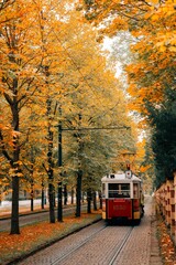 Obraz premium An old tram rides along an autumn alley in Prague