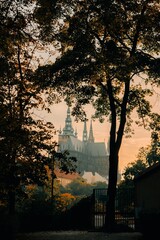 Gothic castle among autumn foliage in Prague