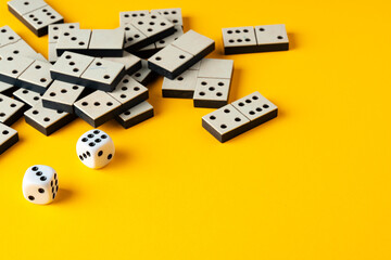 Domino tiles on yellow background studio shot