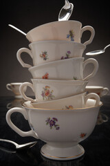 Teapot, teacups & silver spoons