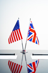 Flags of USA and United Kingdom on negotiation table
