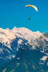 Alpine summer view with a paraglider at Mount Seefelder Joch, Rosshuette,  Seefeld, Tyrol, Austria