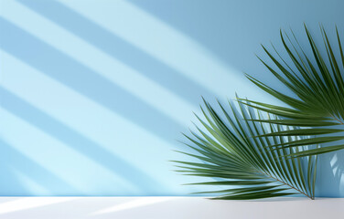 Empty white table top with tropical palm leaves on a blue wall background. High quality photo