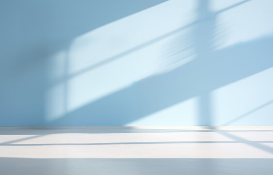 Empty room with blue wall, white floor and sunlight from the window background. High quality photo