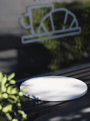 3d ceramic display podium on the dark steel bench with blurred background. 3d rendering of realistic presentation for product advertising. interior illustration.