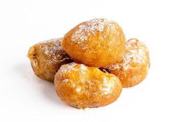 Plate of buñuelos de viento with cream and truffle typical dessert of the day of the saints in Spain