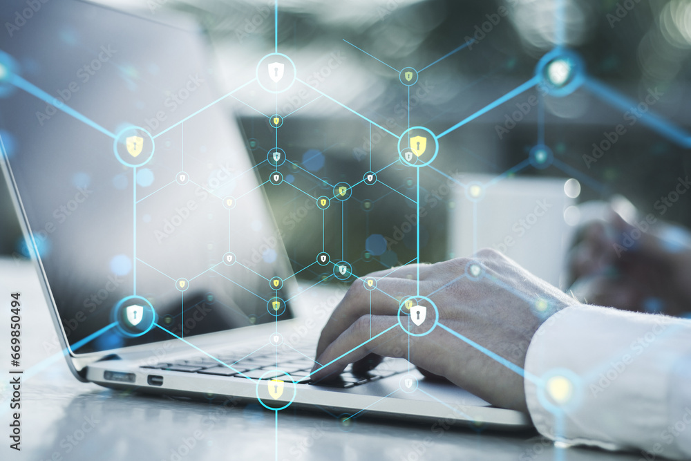 Poster close up of male hands using laptop with creative glowing hexagonal pattern with tiny padlocks on bl