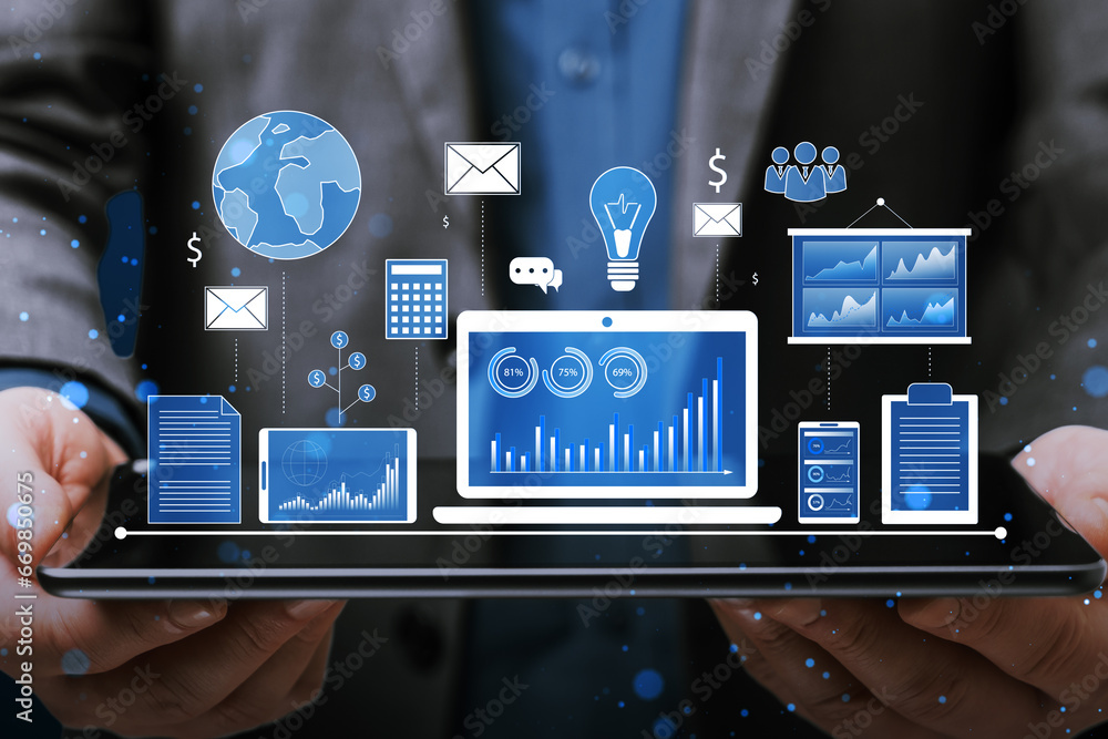 Poster close up of businessman hand holding tablet with financial data and accounting hologram with devices