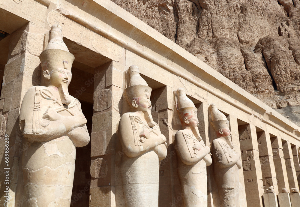 Poster statues of queen hatshepsut at entrance of deir el-bahari (deir el-bahri) the mortuary temple of hat