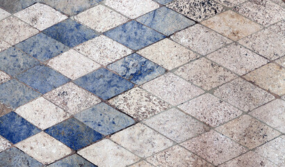 Horizontal or vertical background with natural granite tiles floor. Granite texture backdrop with vintage rhomboidal tile of blue and gray color. Polished Egyptian red granite slabs