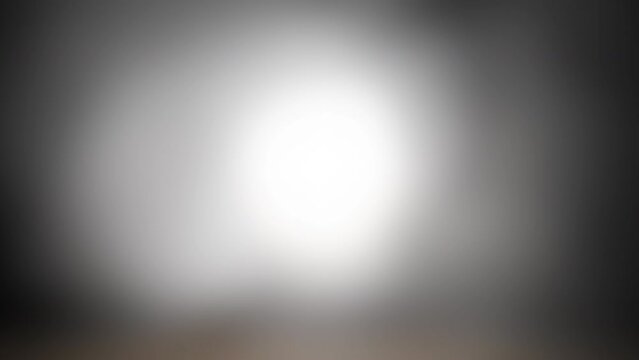 Strange, glowing, alien, UFO orb light, ghost or moon light with smoke and fog for halloween or science fiction, sci-fi background.