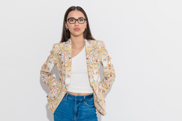 sexy smart casual girl with paisley print jacket and glasses posing