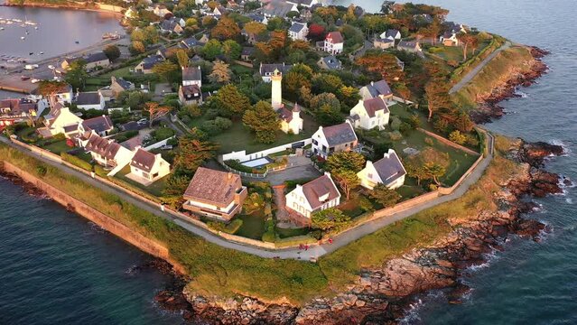 Drone shot, drone flight along the coast, beach, from the Atlantic Ocean to the port of Port Navalo in Arzon in the evening light, marina with sailboats, department of Morbihan, Brittany, France