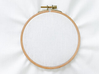 white linen fabric textile with wooden embroidery hoop for embroidery stitch craft