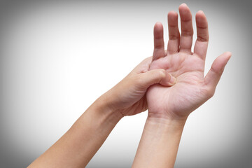 Woman suffering from palm pain, or finger pain. Hand numbness or limb numbness. Isolated on white....