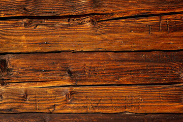 Surface of the old plank texture eroded by time and caries