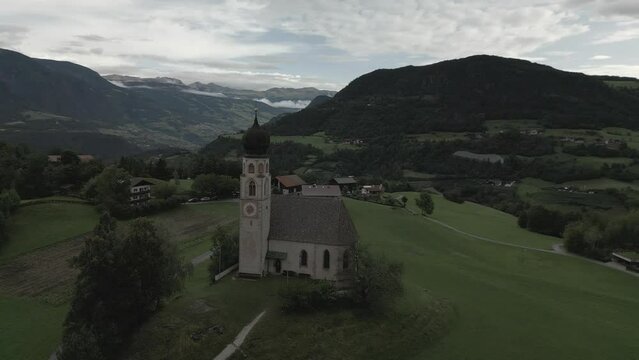 Drone footage of St. Constantine Church and Schlern mountain in Fie allo Sciliar, South Tyrol, Italy