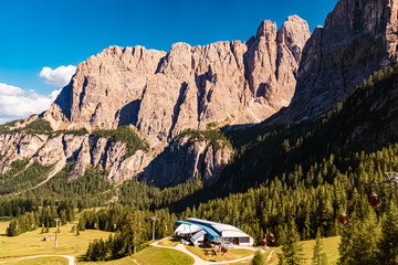 Alpine summer view with a winding road near Passo Gardena, Dolomites, South Tyrol, Italy